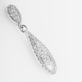 White gold earring with diamond-like stones on a light gray background