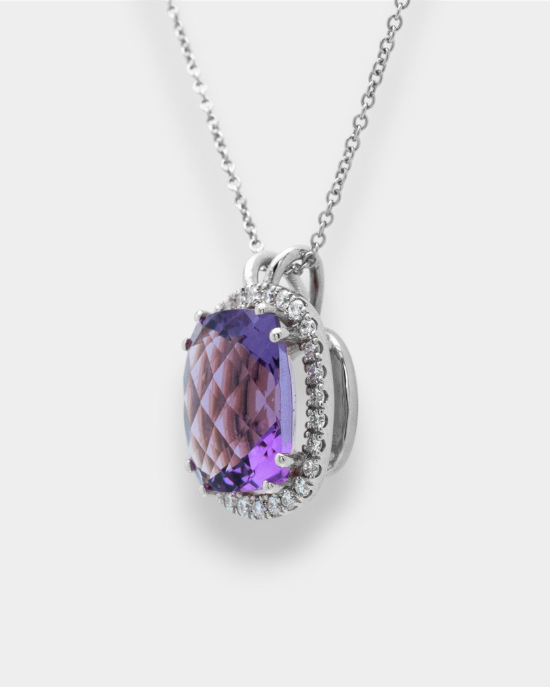 Necklace with a purple amethyst on a white background