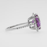 White good ring with a purple amethyst on a white background