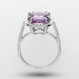 White gold ring with a purple amethyst on a white background