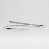White gold bracelet with small diamonds on a light gray background