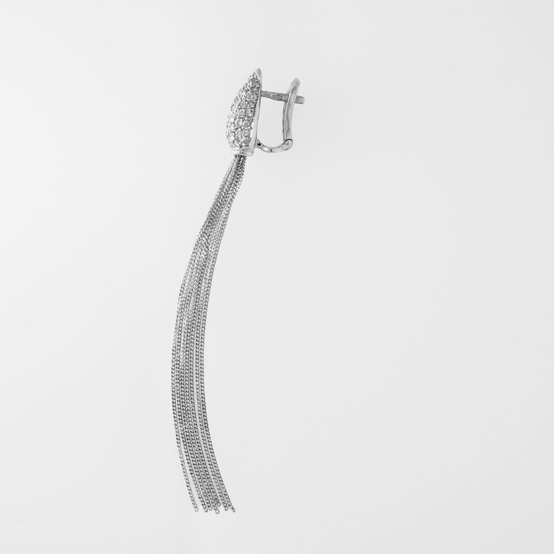 White gold earring with multiple strands on a light gray background