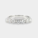 White gold ring with diamonds on a light gray background