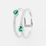 White gold ring with emerald green gemstones on a white background