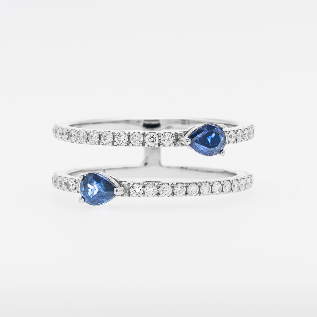 Double band rings with blue sapphires on a white background