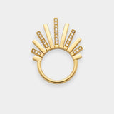 Gold ring with sunburst design on a white background