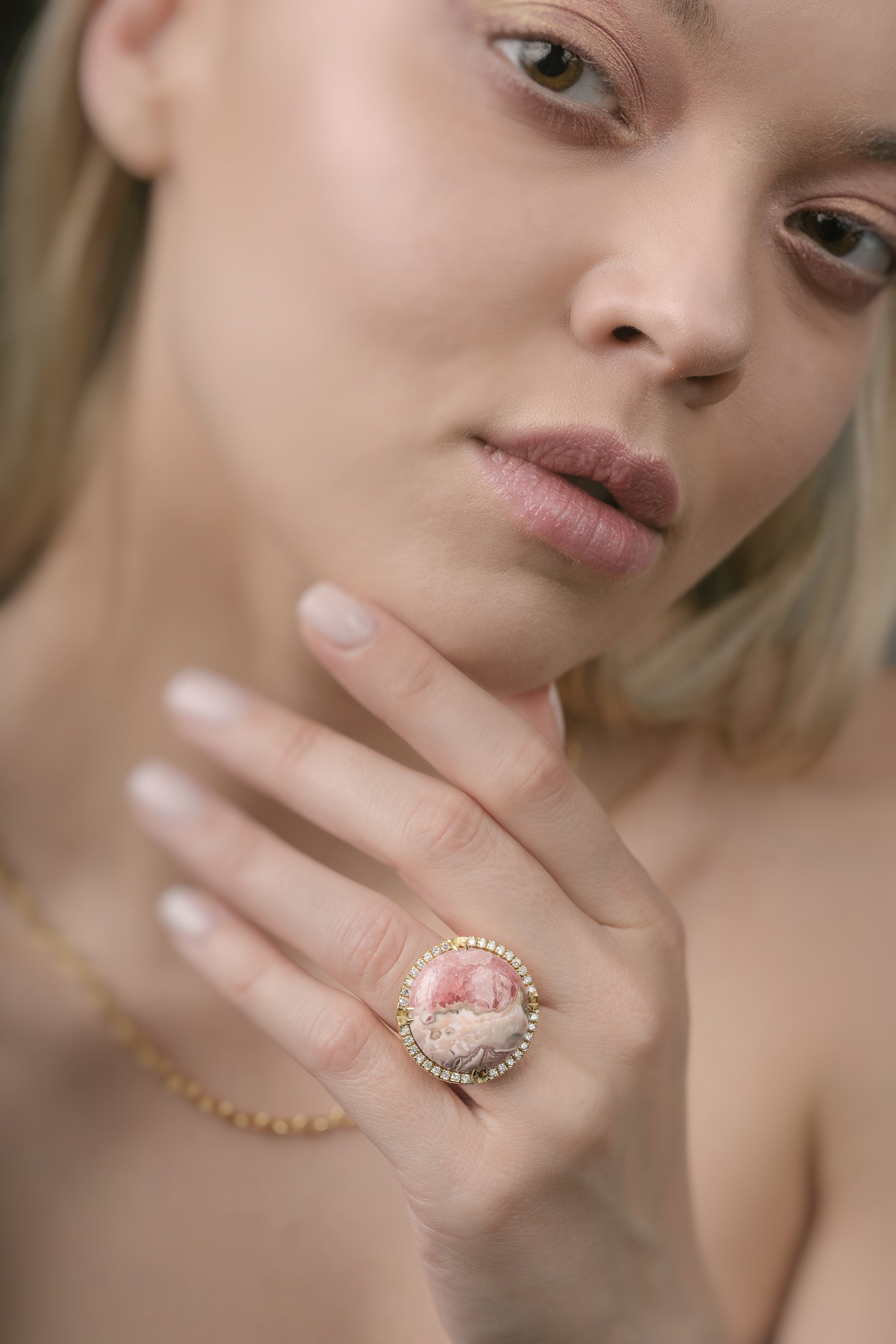 Close-up of a woman wearing a decorative ring on her finger