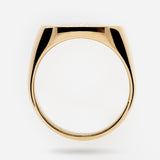 Gold signet ring on a white background