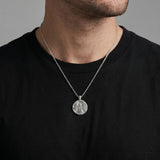 Coin necklace with angel image worn by a man model 