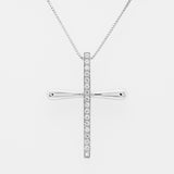 White gold cross pendant necklace with diamonds on a light gray background
