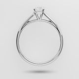 White gold ring with a diamond on a light gray background