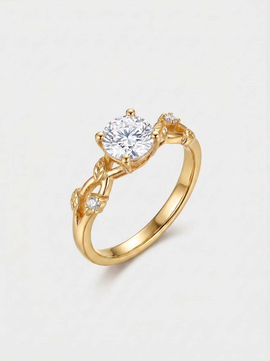 Gold ring with a diamond with a vine shape shank on a light gray background