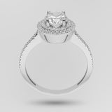White gold engagement ring with a brilliant-cut diamond and double halo on a light gray background