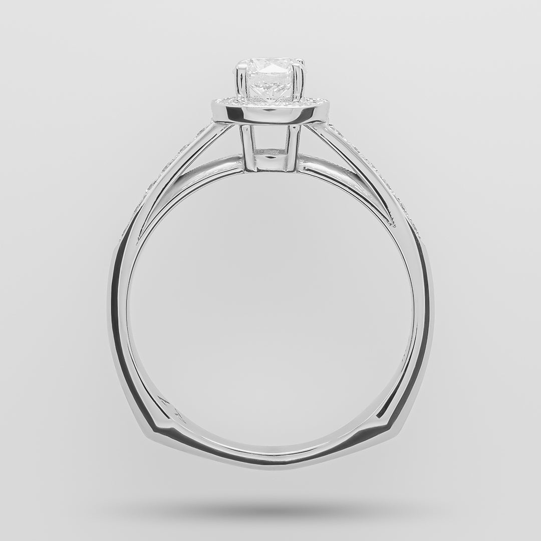 White-gold ring with a diamond on a light gray background