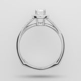 White-gold ring with a diamond on a light gray background