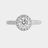 Diamond ring with a clear gemstone on a light gray background