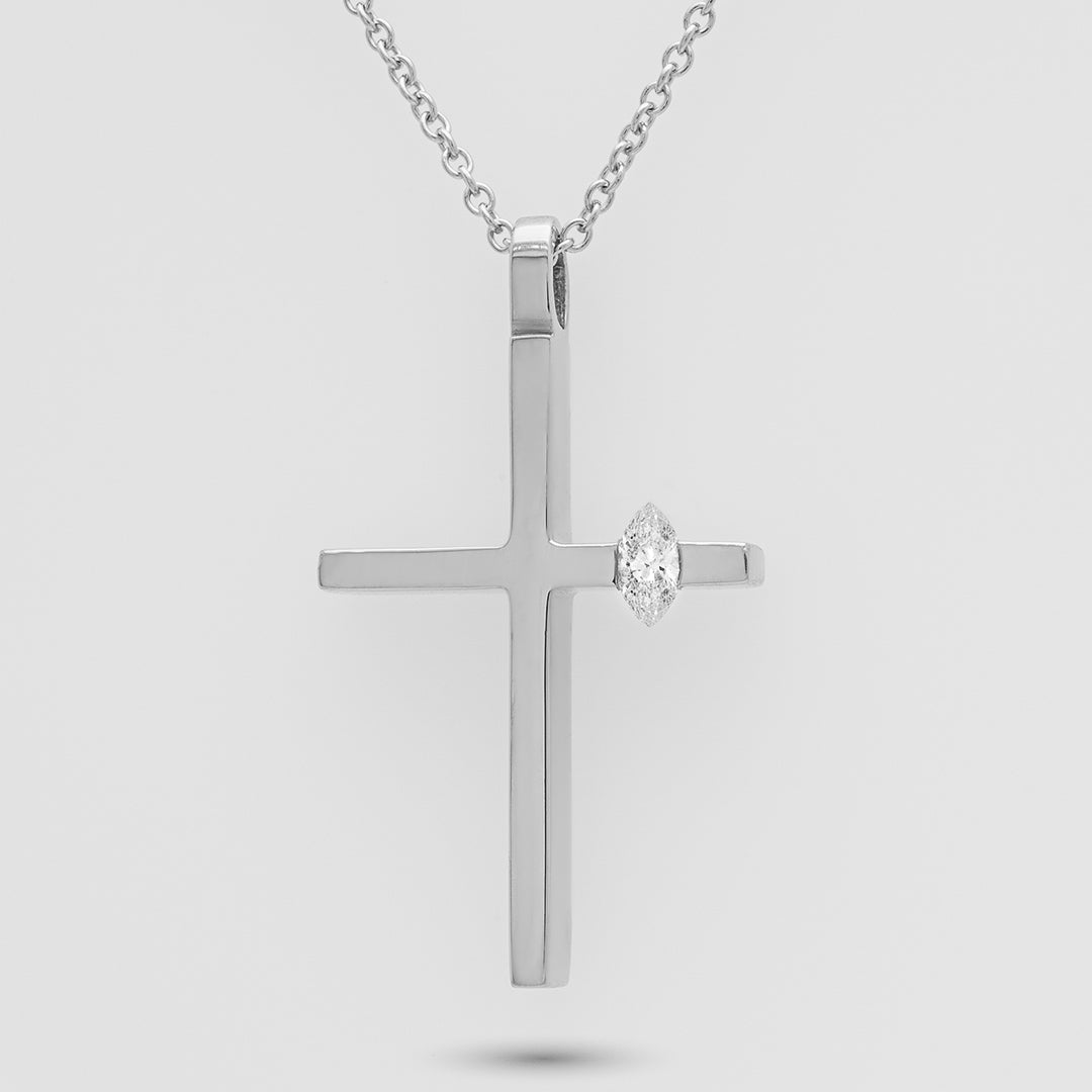 White gold cross pendant with a diamond on a light gray background