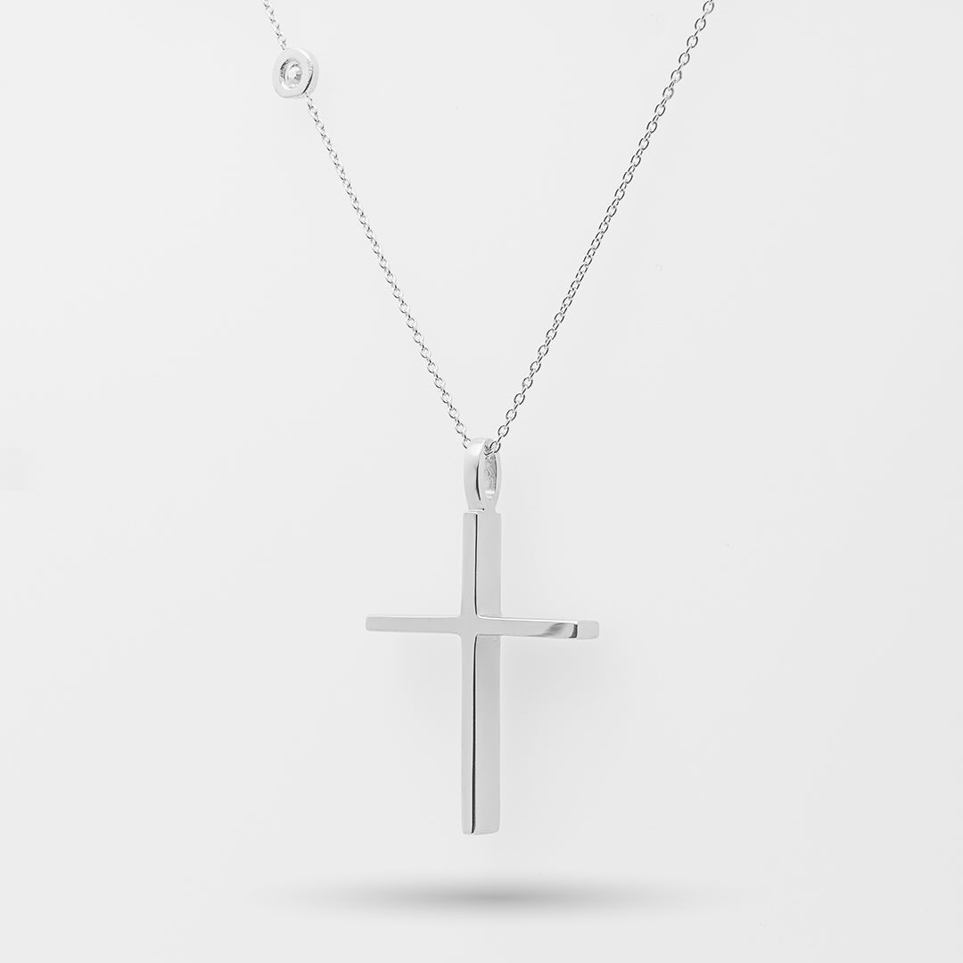 White gold cross necklace on a white background