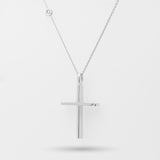 White gold cross necklace on a white background