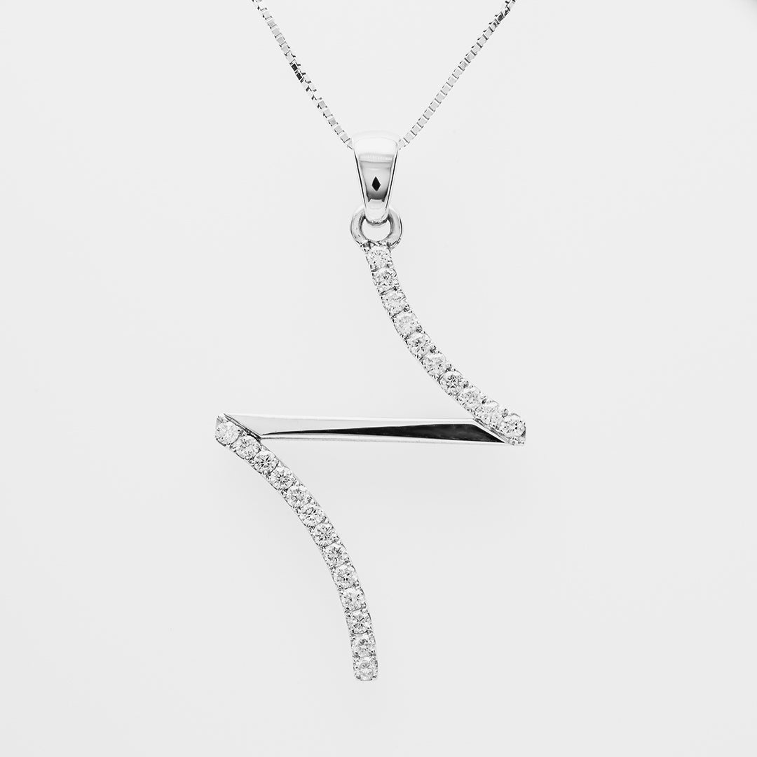 Diamond necklace with a wavy design that is like a cross on a white background