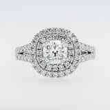 Diamond ring with a halo on a light gray background