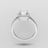 White gold cushion-shaped ring with a diamond on a light gray background