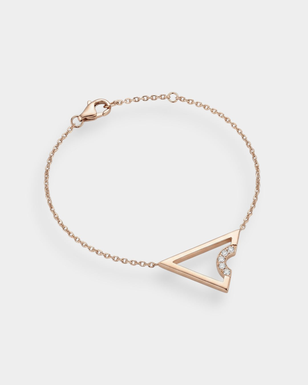 Rose gold bracelet with a triangle design on a light gray background