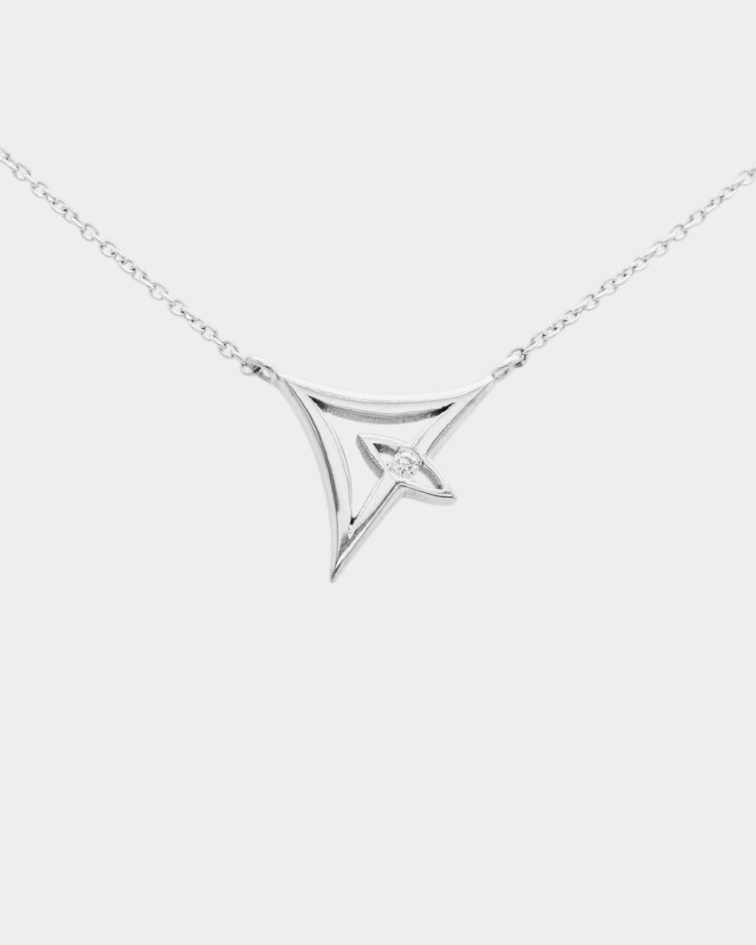 delta shaped necklace with an eye 