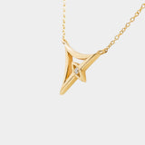 Gold necklace with a geometric pendant on a white background