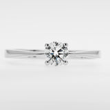 White gold ring with a diamond on a light gray background