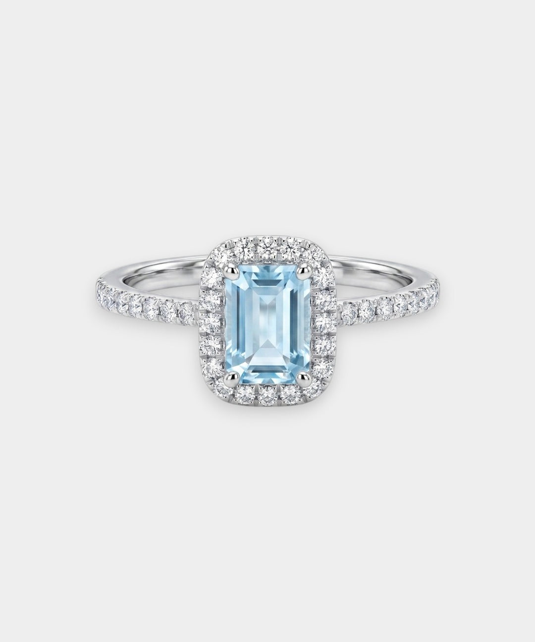 Silver ring with a blue aquamarine gemstone on a white background