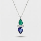 Necklace with emerald and sapphire pendant on a white background