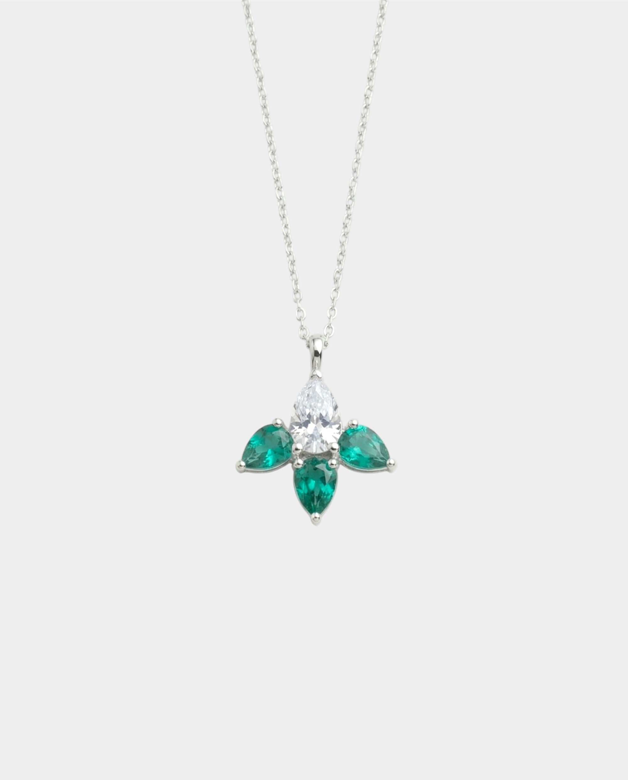 Diamond and emerald necklace on a white background