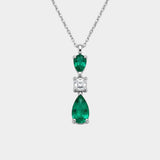 Diamond and emerald necklace on a white background
