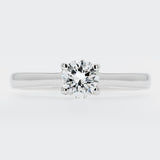 Diamond ring on a light gray background