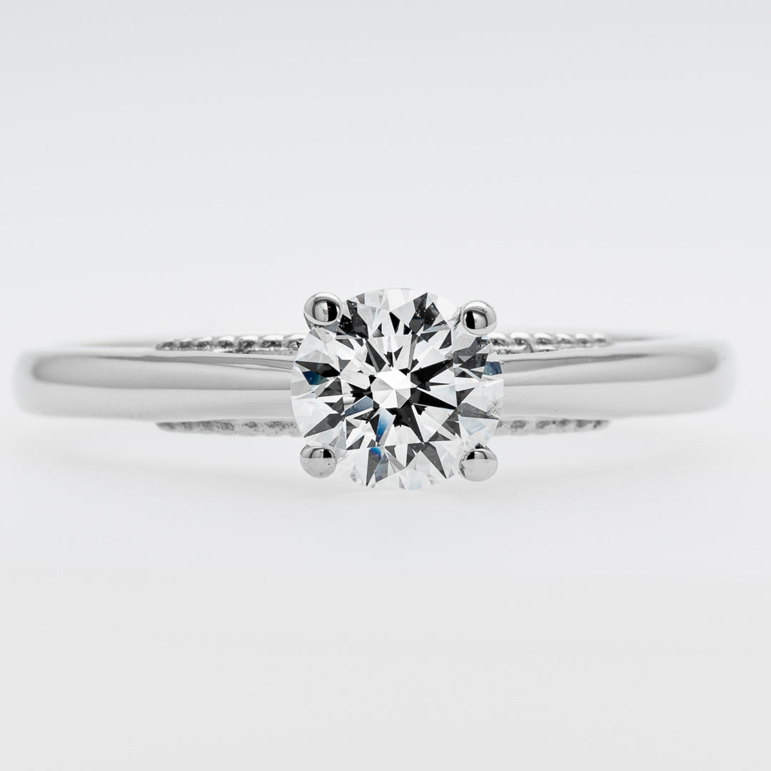 Diamond ring on a light gray background