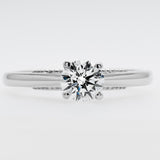 Diamond ring on a light gray background