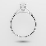 White gold enegagement ring with a diamond on a light gray background