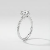 Engagement ring with a diamond on a light gray background