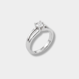 A white-gold solitaire engagement ring with a round-cut diamond, set on a clean light gray background.