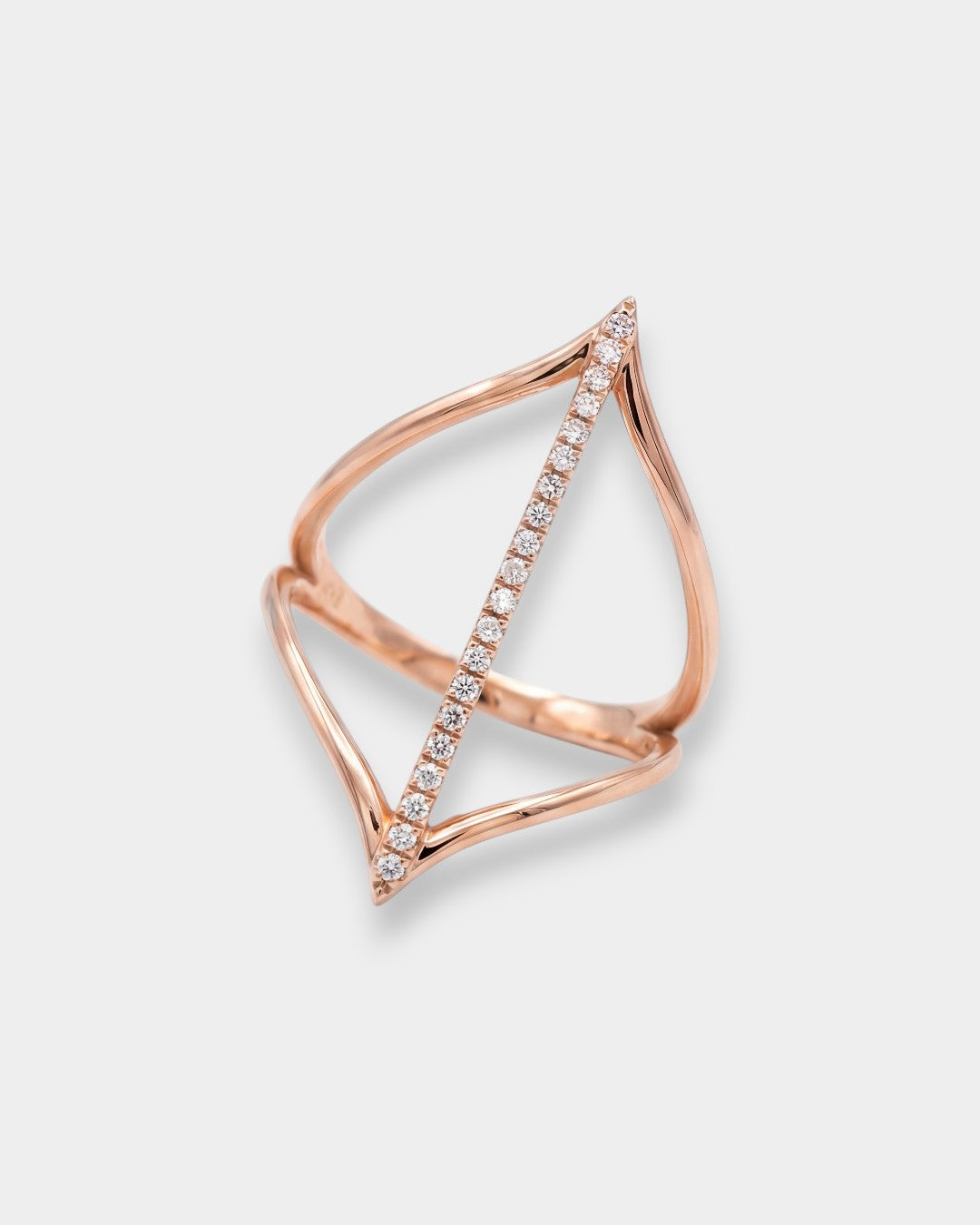 Rose gold ring with diamond accents on a light gray background