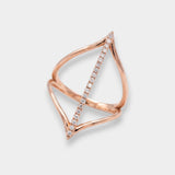 Rose gold ring with diamond accents on a light gray background