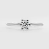Diamond ring on a light gray background