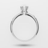 White gold engagement ring with a diamond on a high-profile over a light gray background