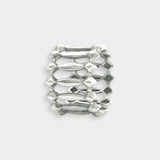 White gold metallic ring with textured design on a white background