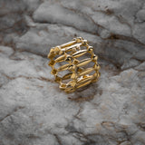 Gold ring on a textured stone surface