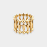 Gold ring with a textured design on a light gray background