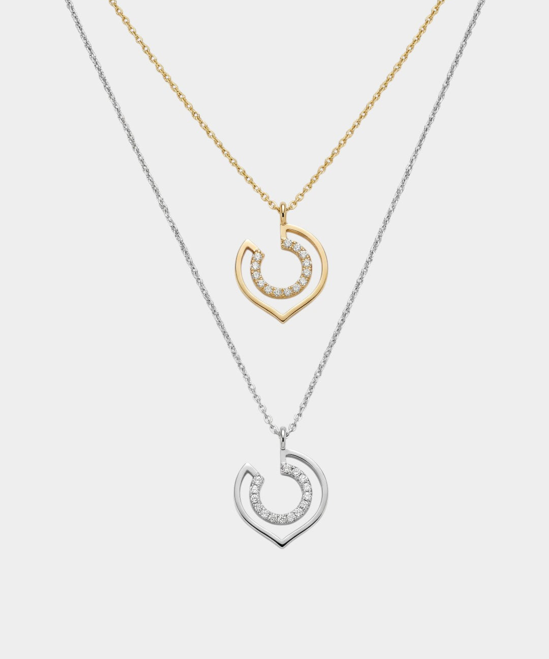 two necklaces in yellow and white gold with geometric shapes
