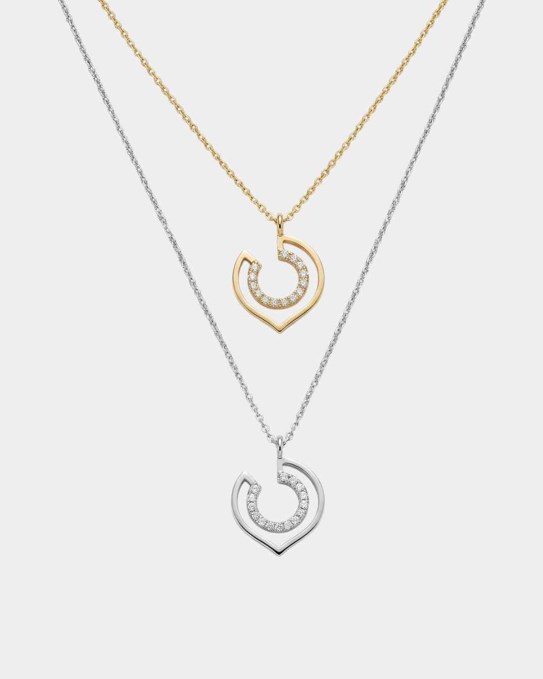 two necklaces in yellow and white gold with geometric shapes