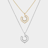 two necklaces in yellow and white gold with geometric shapes